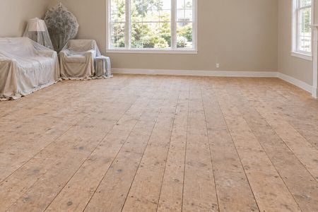 Homeowner preparing a room before new flooring installation | DeGraaf Interiors